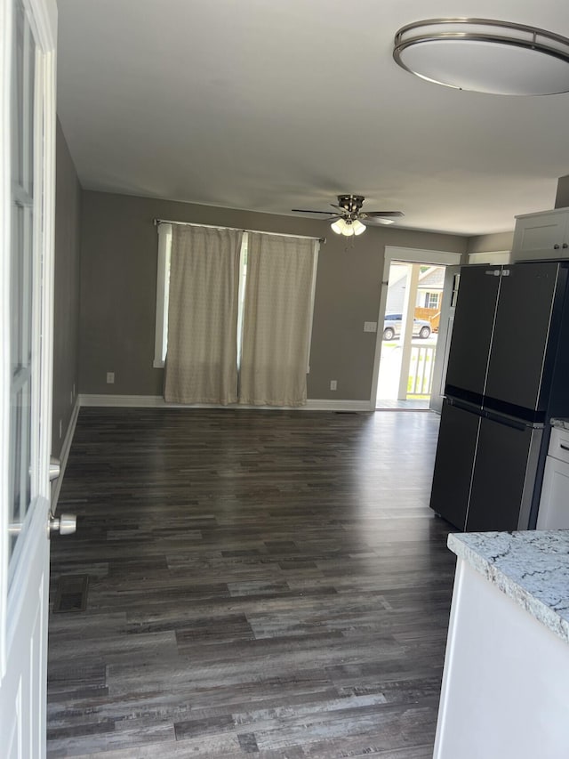 204 Roslyn Ct, Dalton, GA 30720 - unfurnished living room with ceiling fan and dark wood finished floors