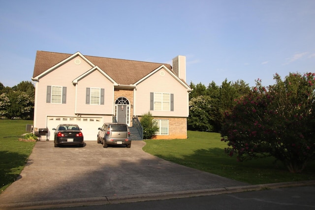 140 Chestnut Ln SE, Calhoun, GA 30701 - bi-level home with a chimney, an attached garage, driveway, and a front lawn