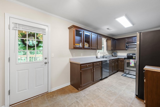 4429 Kayla Cir, Chattanooga, TN 37406 - kitchen with appliances with stainless steel finishes, plenty of natural light, light countertops, and ornamental molding