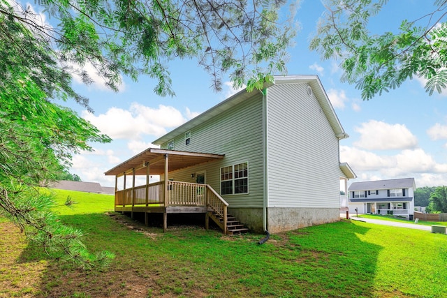4429 Kayla Cir, Chattanooga, TN 37406 - rear view of property featuring a deck, a lawn, and stairway