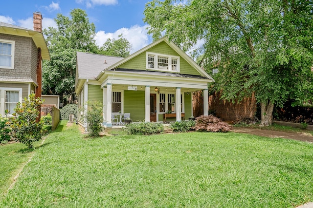 4503 Saint Elmo Ave, Chattanooga, TN 37409 - view of front of property featuring covered porch, a front lawn, and a chimney