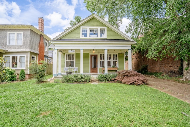 4503 Saint Elmo Ave, Chattanooga, TN 37409 - view of front of property featuring a porch, a chimney, and a front yard