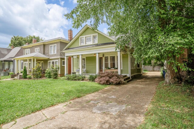 4503 Saint Elmo Ave, Chattanooga, TN 37409 - view of front of house featuring a porch, driveway, and a front lawn