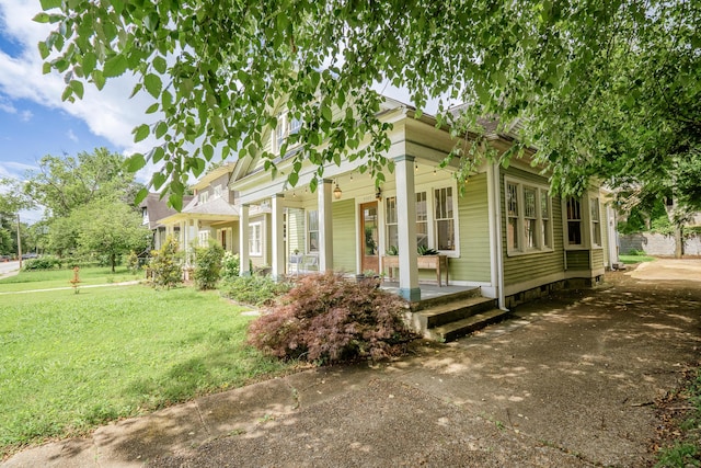 4503 Saint Elmo Ave, Chattanooga, TN 37409 - view of side of home featuring covered porch and a yard