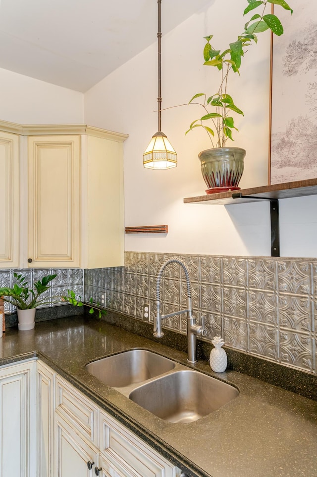 4503 Saint Elmo Ave, Chattanooga, TN 37409 - kitchen with cream cabinets, backsplash, decorative light fixtures, and dark stone countertops