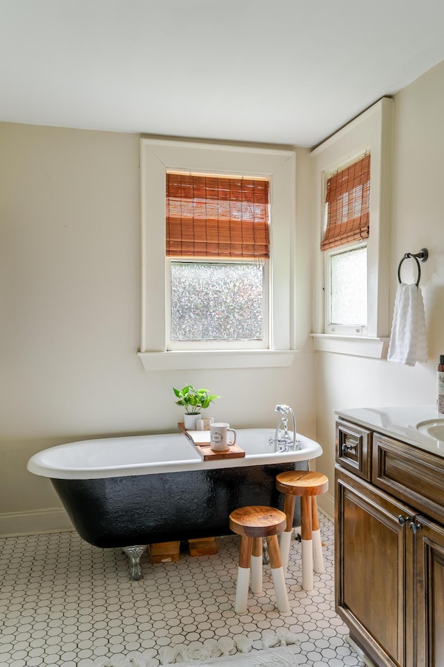 4503 Saint Elmo Ave, Chattanooga, TN 37409 - bathroom with vanity, a freestanding tub, and tile patterned floors