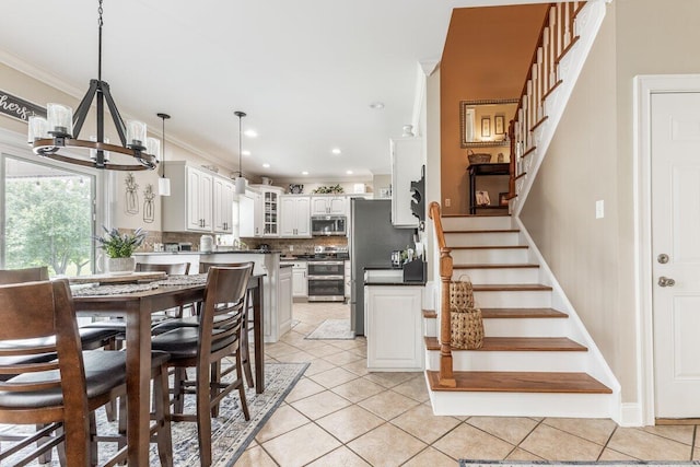 234 Holcomb Rd, Ringgold, GA 30736 - dining space featuring a chandelier, crown molding, stairway, light tile patterned flooring, and recessed lighting