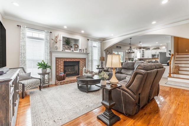 234 Holcomb Rd, Ringgold, GA 30736 - living room with arched walkways, healthy amount of natural light, light wood-style floors, ornamental molding, and recessed lighting