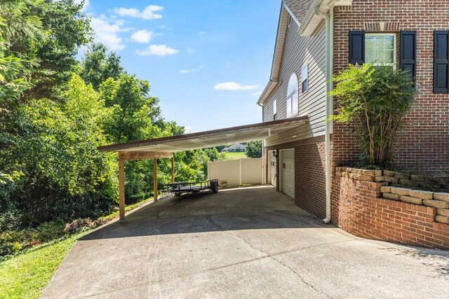 234 Holcomb Rd, Ringgold, GA 30736 - view of vehicle parking featuring concrete driveway and an attached carport