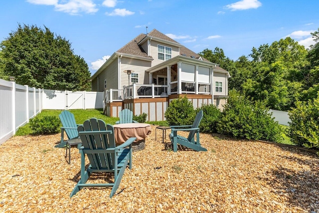 234 Holcomb Rd, Ringgold, GA 30736 - rear view of property with an outdoor fire pit, a gate, a fenced backyard, a deck, and a shingled roof