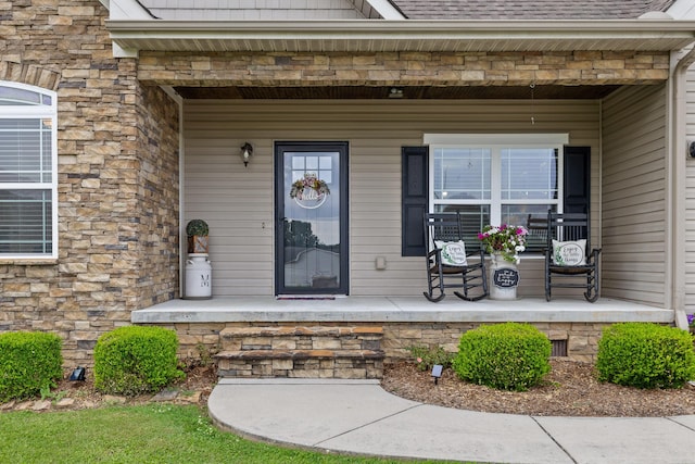 220 Charlene Pl, South Pittsburg, TN 37380 - property entrance featuring covered porch, stone siding, and a shingled roof