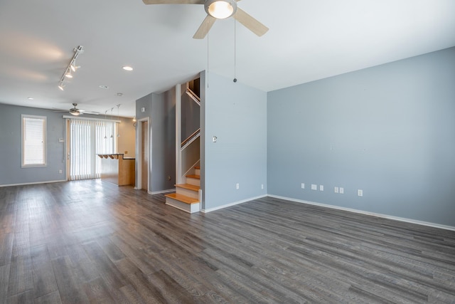 277 W 19th St, Chattanooga, TN 37408 - unfurnished living room with ceiling fan, stairway, dark wood-style flooring, and rail lighting