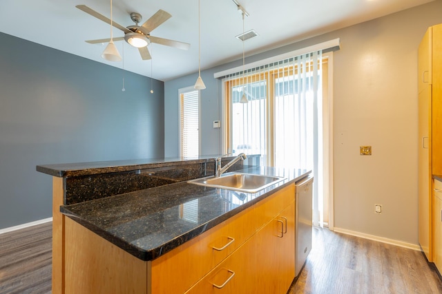 277 W 19th St, Chattanooga, TN 37408 - kitchen with a kitchen island with sink, wood finished floors, a ceiling fan, dishwasher, and pendant lighting
