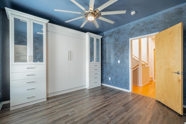 277 W 19th St, Chattanooga, TN 37408 - unfurnished bedroom with dark wood finished floors, a closet, and wallpapered walls