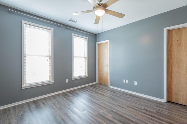 277 W 19th St, Chattanooga, TN 37408 - empty room with wood finished floors, plenty of natural light, and a ceiling fan