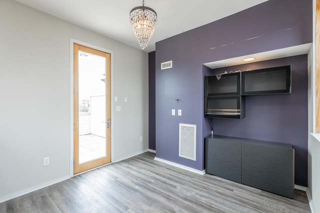 277 W 19th St, Chattanooga, TN 37408 - unfurnished dining area featuring a chandelier and wood finished floors