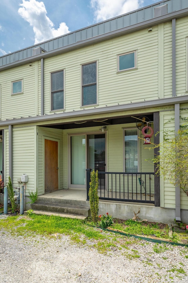 277 W 19th St, Chattanooga, TN 37408 - view of front facade featuring covered porch, a metal roof, and a standing seam roof