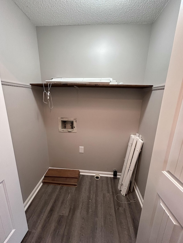 4594 Lee Dr NW, Cleveland, TN 37312 - laundry room featuring radiator heating unit, washer hookup, wood finished floors, and a textured ceiling