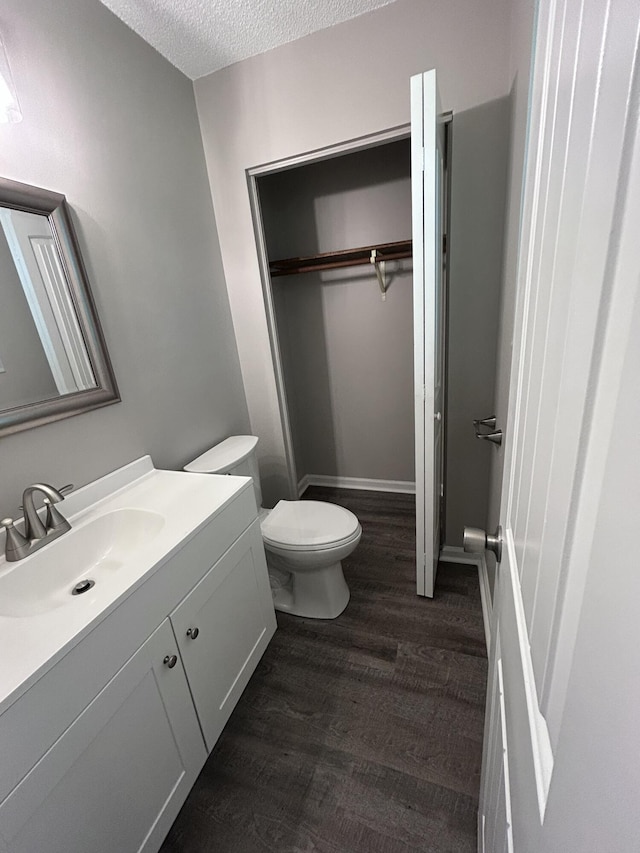 4594 Lee Dr NW, Cleveland, TN 37312 - bathroom with vanity, wood finished floors, and a textured ceiling