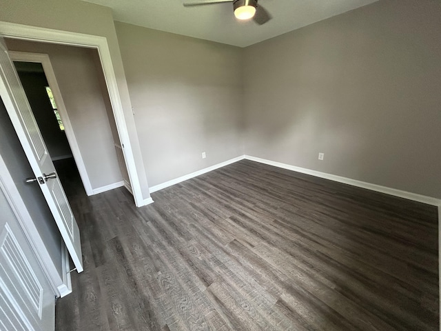 4594 Lee Dr NW, Cleveland, TN 37312 - unfurnished bedroom with dark wood-type flooring and ceiling fan