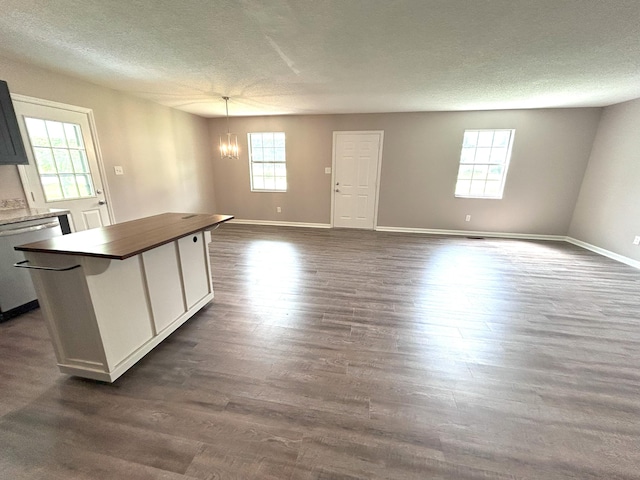 4594 Lee Dr NW, Cleveland, TN 37312 - kitchen featuring stainless steel dishwasher, healthy amount of natural light, a textured ceiling, a chandelier, and a center island