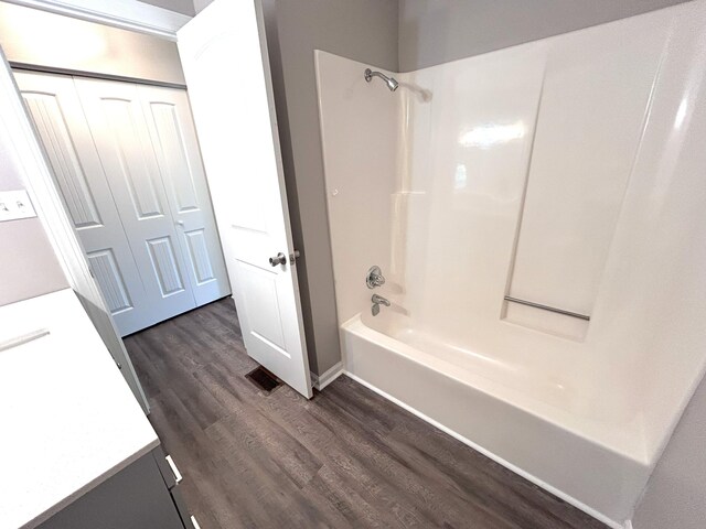 4594 Lee Dr NW, Cleveland, TN 37312 - bathroom featuring wood finished floors, bathtub / shower combination, and vanity