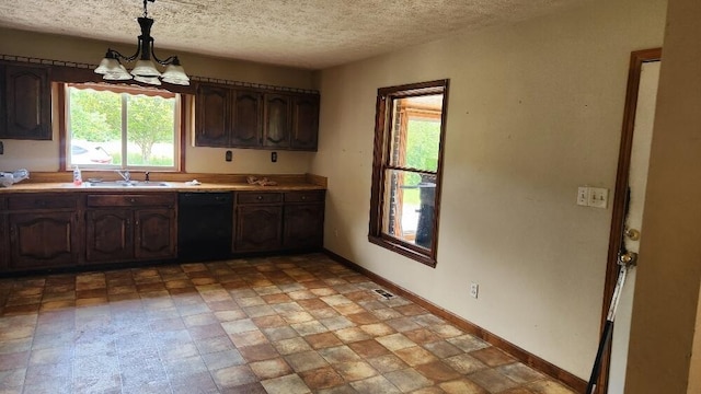 271 Anderson Rd, Palmer, TN 37365 - kitchen featuring dishwasher, a textured ceiling, a chandelier, light countertops, and hanging light fixtures