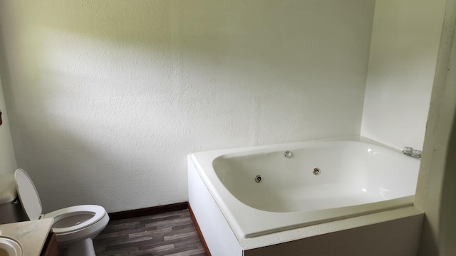 271 Anderson Rd, Palmer, TN 37365 - bathroom featuring a jetted tub, wood finished floors, and vanity