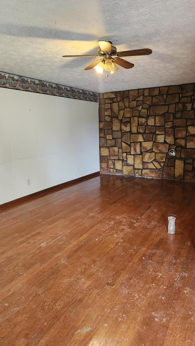 271 Anderson Rd, Palmer, TN 37365 - empty room with ceiling fan, wood-type flooring, and a textured ceiling