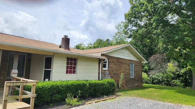 271 Anderson Rd, Palmer, TN 37365 - view of side of home with a chimney, a lawn, and brick siding