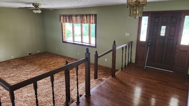 271 Anderson Rd, Palmer, TN 37365 - entryway featuring wood-type flooring, plenty of natural light, ceiling fan, a chandelier, and a textured ceiling
