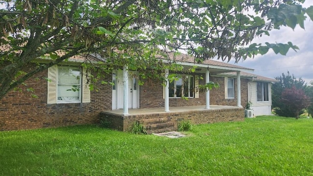 271 Anderson Rd, Palmer, TN 37365 - ranch-style house with a front yard and covered porch
