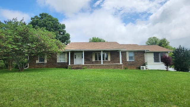 271 Anderson Rd, Palmer, TN 37365 - ranch-style house with a front yard, covered porch, and brick siding