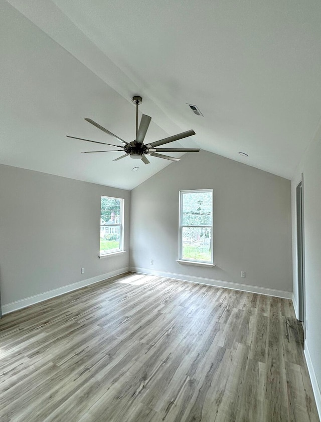 5303 Marion Ave, Chattanooga, TN 37412 - unfurnished room with ceiling fan, light wood-style floors, and vaulted ceiling