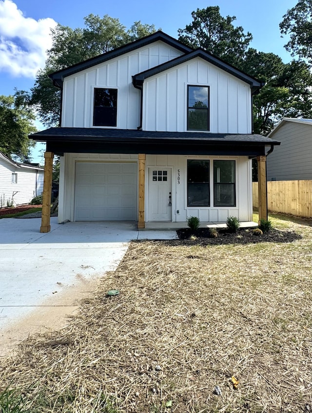 5303 Marion Ave, Chattanooga, TN 37412 - modern inspired farmhouse featuring board and batten siding, an attached garage, and driveway