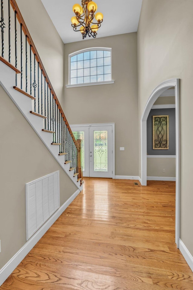 231 Turkey Run, Flintstone, GA 30725 - foyer featuring a chandelier, a high ceiling, wood finished floors, stairs, and arched walkways
