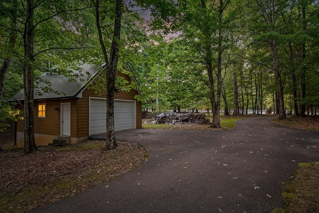 68 Bluff View Dr, Dunlap, TN 37327 - view of side of home with a metal roof and a garage
