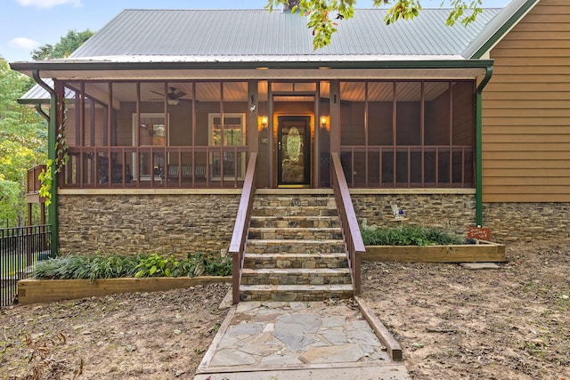 68 Bluff View Dr, Dunlap, TN 37327 - view of front of home with a sunroom, a metal roof, stairs, stone siding, and a vegetable garden