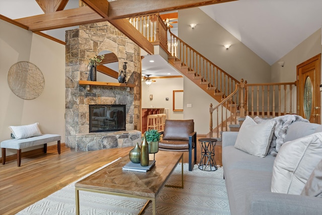 68 Bluff View Dr, Dunlap, TN 37327 - living room with wood finished floors, stairway, a stone fireplace, high vaulted ceiling, and ceiling fan