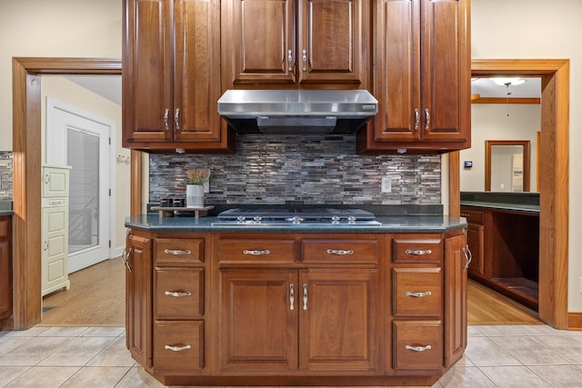 68 Bluff View Dr, Dunlap, TN 37327 - kitchen featuring range hood, stainless steel gas stovetop, light tile patterned floors, and backsplash