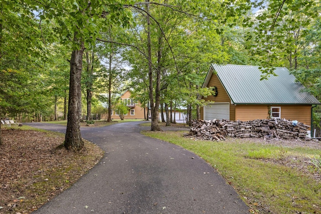 68 Bluff View Dr, Dunlap, TN 37327 - view of side of property with a garage and a metal roof
