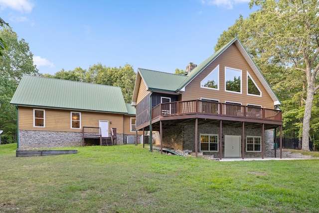 68 Bluff View Dr, Dunlap, TN 37327 - rear view of house with stone siding, a deck, and a metal roof