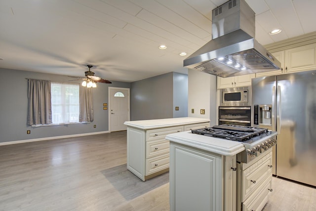 6632 Gamble Rd, Birchwood, TN 37308 - kitchen with island range hood, appliances with stainless steel finishes, a center island, ceiling fan, and light wood finished floors