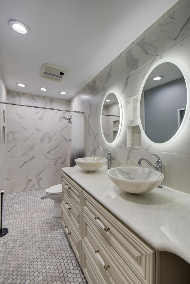 6632 Gamble Rd, Birchwood, TN 37308 - full bath featuring tile walls, double vanity, a marble finish shower, recessed lighting, and decorative backsplash