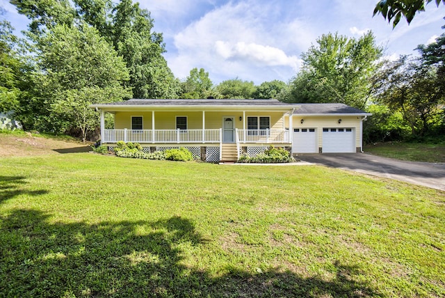 6632 Gamble Rd, Birchwood, TN 37308 - view of front of house with covered porch, asphalt driveway, an attached garage, and a front yard