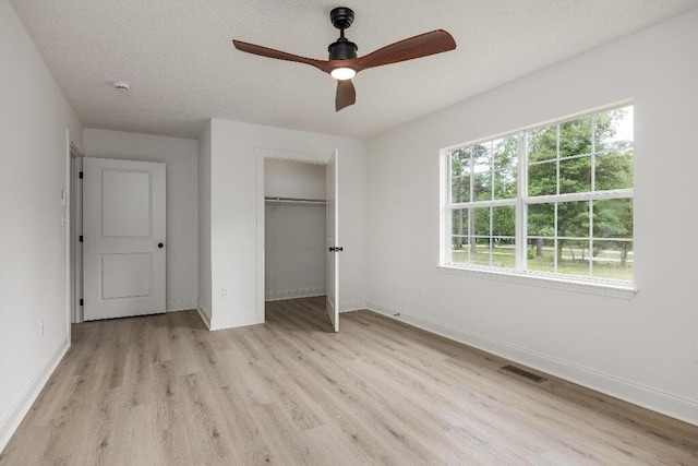 8208 Hixson Springs Rd, Signal Mountain, TN 37377 - unfurnished bedroom with light wood-style floors, a closet, and ceiling fan