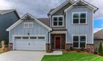 549 Double Play Dr Unit 137, Chattanooga, TN 37421 - view of front of property featuring board and batten siding, driveway, and a front yard
