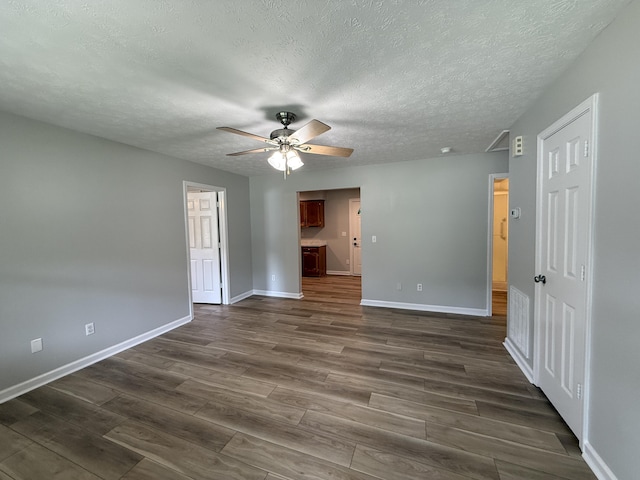 9424 Fuller Rd, Chattanooga, TN 37421 - empty room with a ceiling fan, dark wood-style flooring, and a textured ceiling