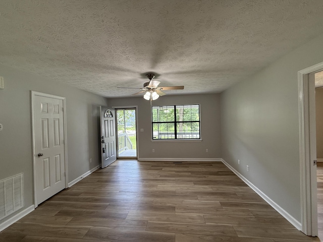 9424 Fuller Rd, Chattanooga, TN 37421 - unfurnished room with ceiling fan, dark wood finished floors, and a textured ceiling