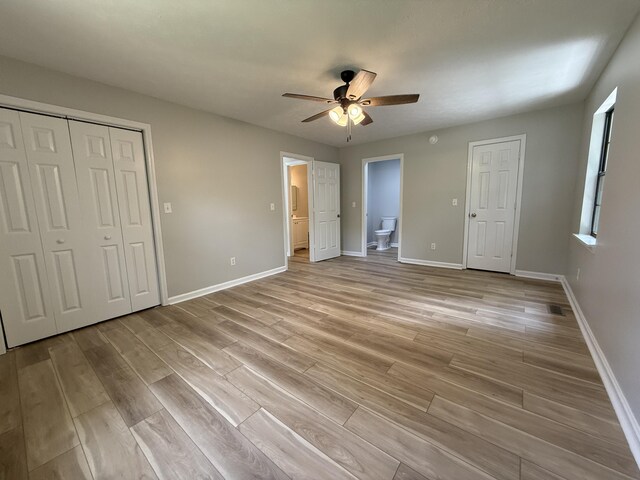 9424 Fuller Rd, Chattanooga, TN 37421 - unfurnished bedroom with light wood-type flooring, ensuite bath, ceiling fan, and a closet